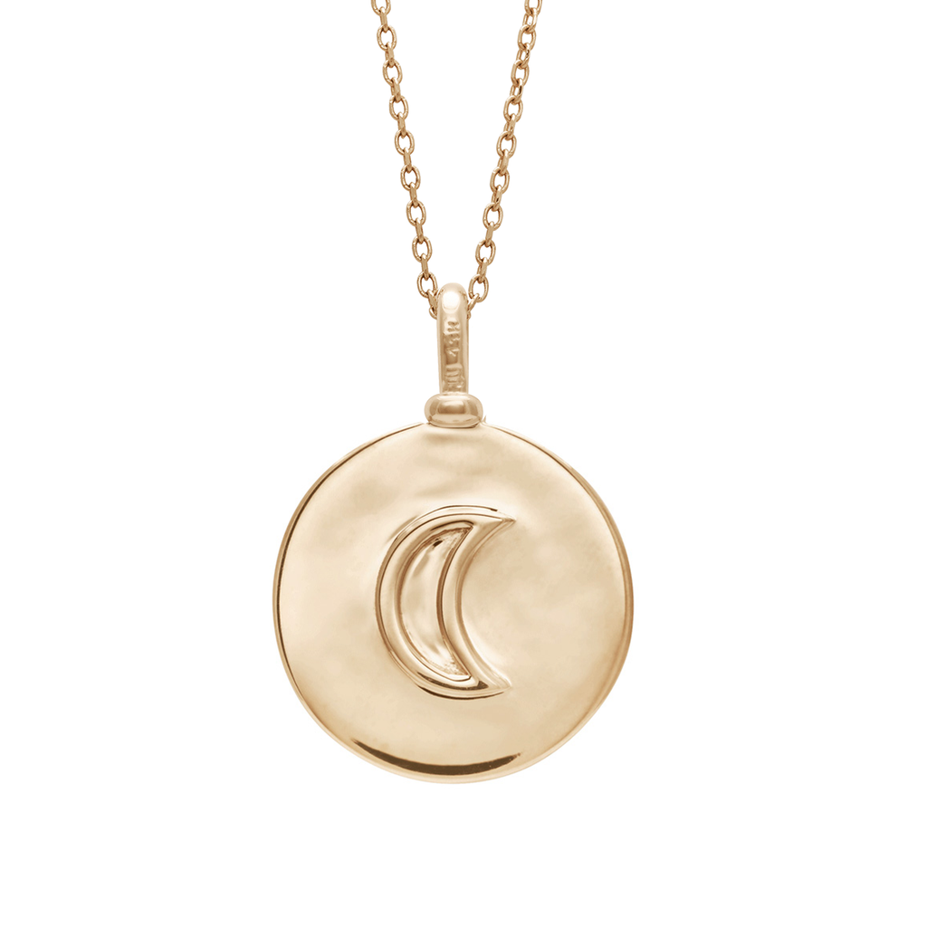 A 18mm charm with the moon sign set in yellow gold on a yellow gold chain.