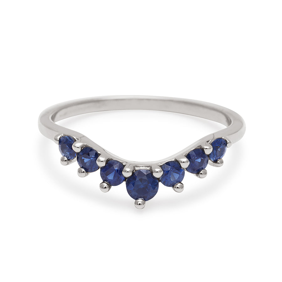 A curved 7 sapphire band set in white gold., White Gold