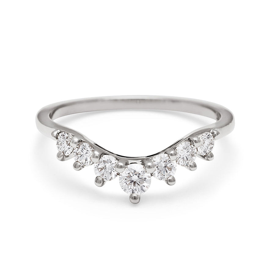 A curved 7 white diamond band set in white gold., White Gold