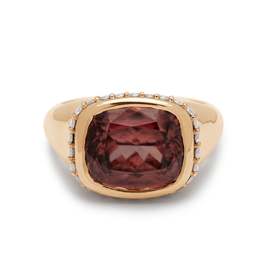 Front view of a cushion cut zircon stone set in a signet style with a white diamond pave halo set in yellow gold.
