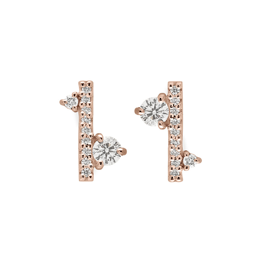 A pair of earrings with straight lines of white diamond pave with white diamond accent stones on either side set in a rose gold., Rose Gold
