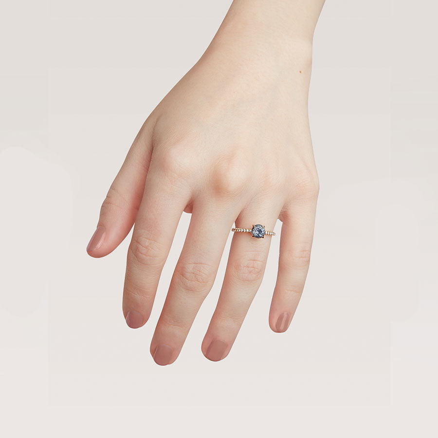 A solitaire round grey spinel ring with claw prongs with white diamond pave on the band set in yellow gold on a light-complexion hand., White Gold, Rose Gold, Yellow Gold