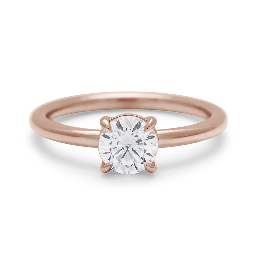 A solitaire round 0.75ct white diamond ring with claw prongs set in rose gold., Rose Gold