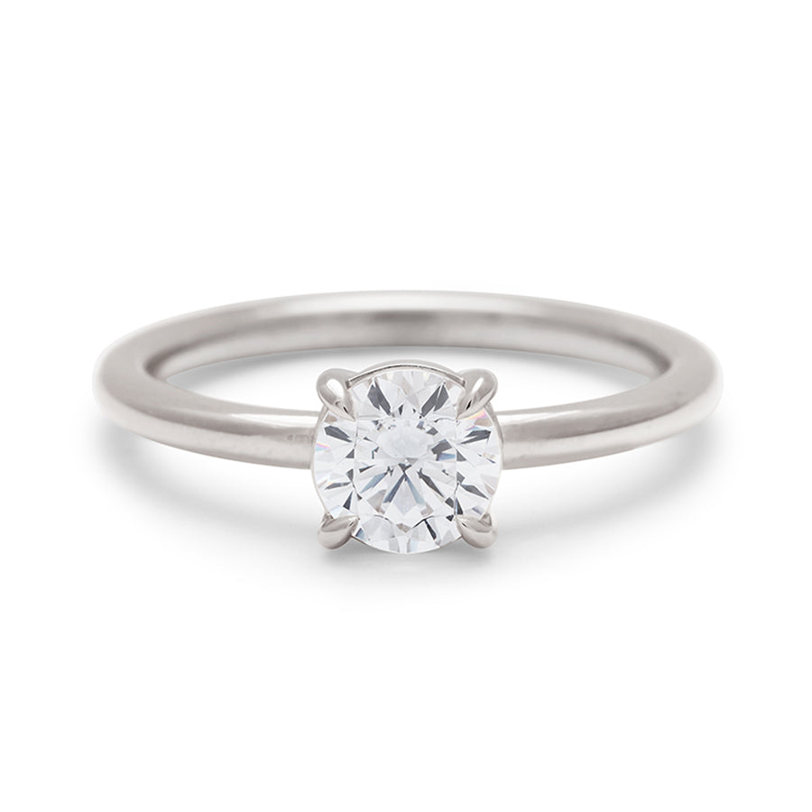 A solitaire round 0.75ct white diamond ring with claw prongs set in white gold., White Gold