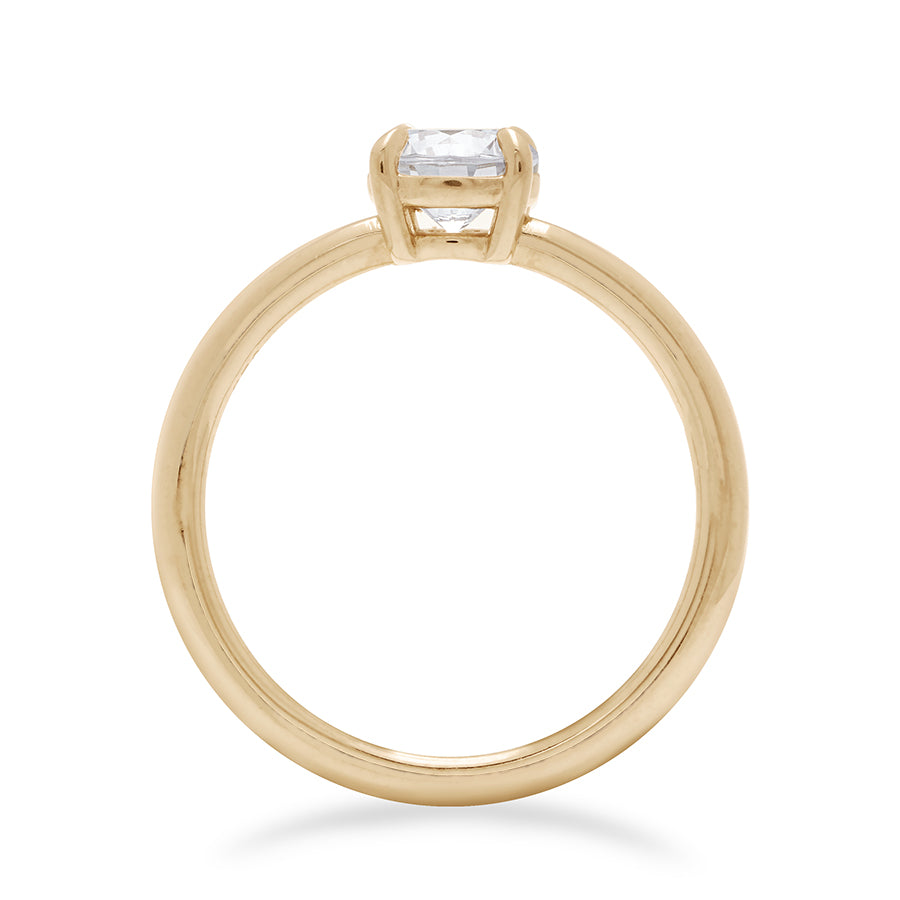 Side view of a solitaire round 0.75ct white diamond ring with claw prongs set in yellow gold., Yellow Gold