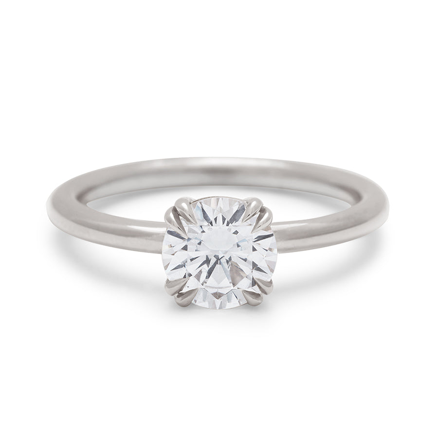 A solitaire round 1.00ct white diamond ring with double claw prongs set in white gold., White Gold