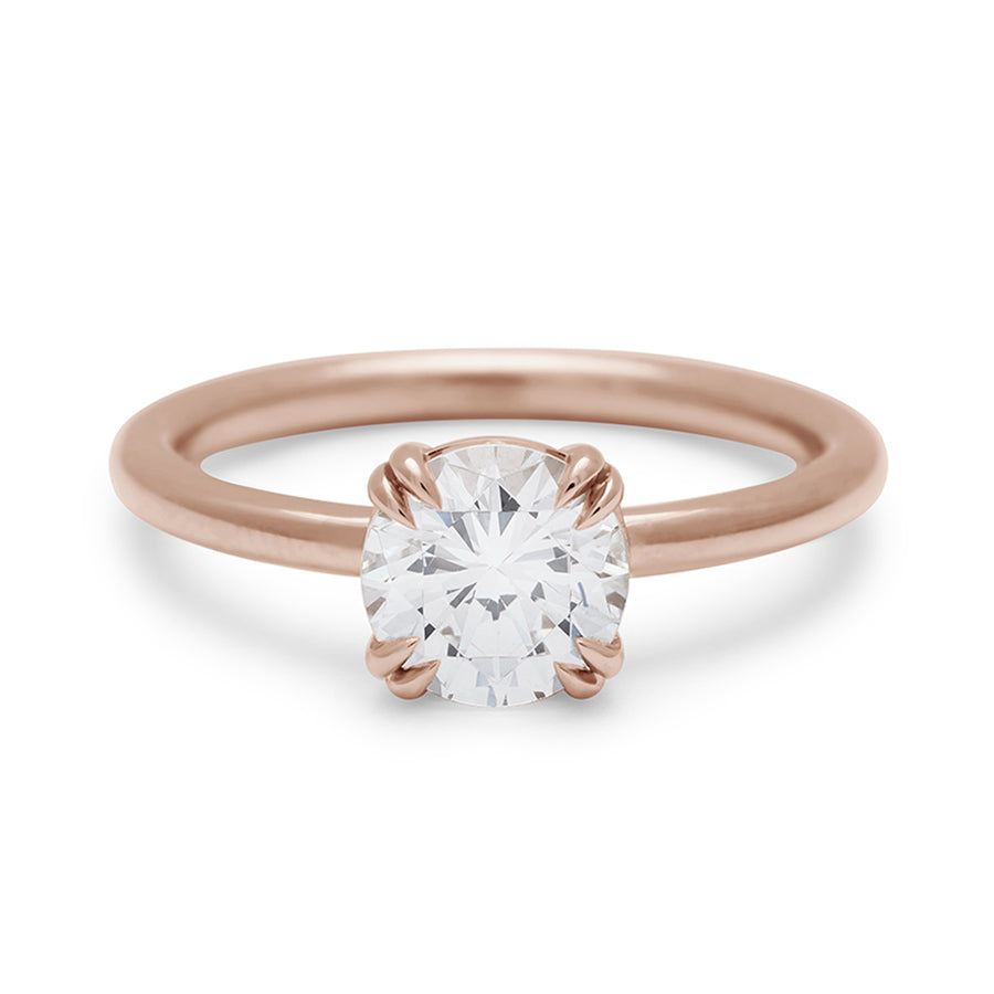 A solitaire round 1.25ct white diamond ring with double claw prongs set in rose gold., Rose Gold