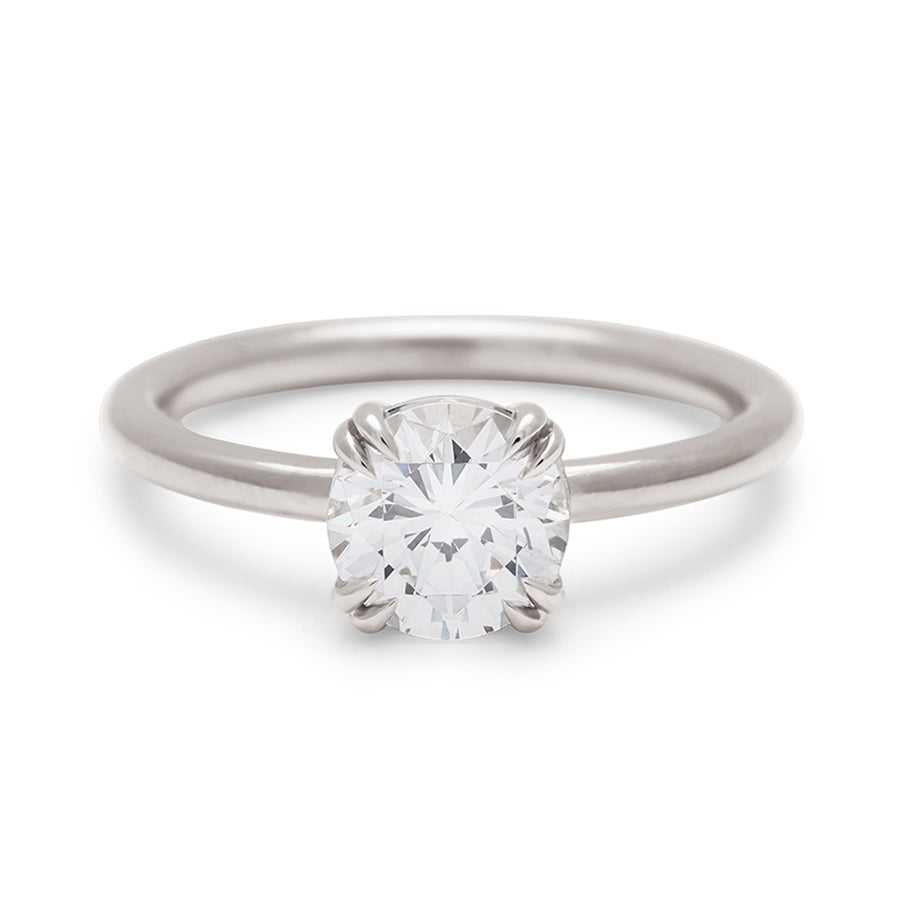 A solitaire round 1.25ct white diamond ring with double claw prongs set in white gold., White Gold