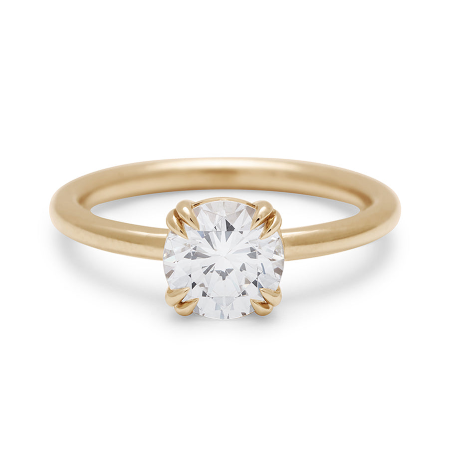 A solitaire round 1.25ct white diamond ring with double claw prongs set in yellow gold., Yellow Gold