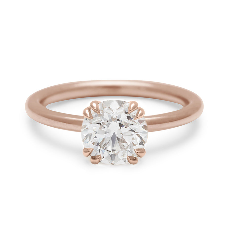 A solitaire round brilliant cut 1.50ct white diamond ring with double claw prongs set in rose gold., Rose Gold