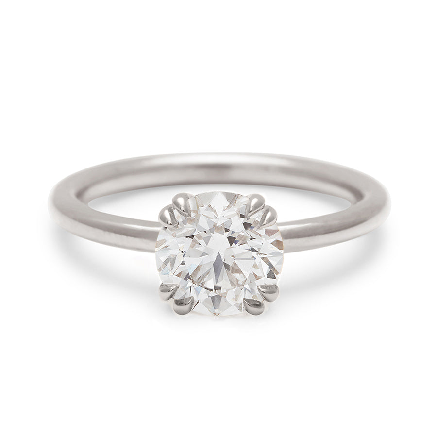 A solitaire round brilliant cut 1.50ct white diamond ring with double claw prongs set in white gold., White Gold