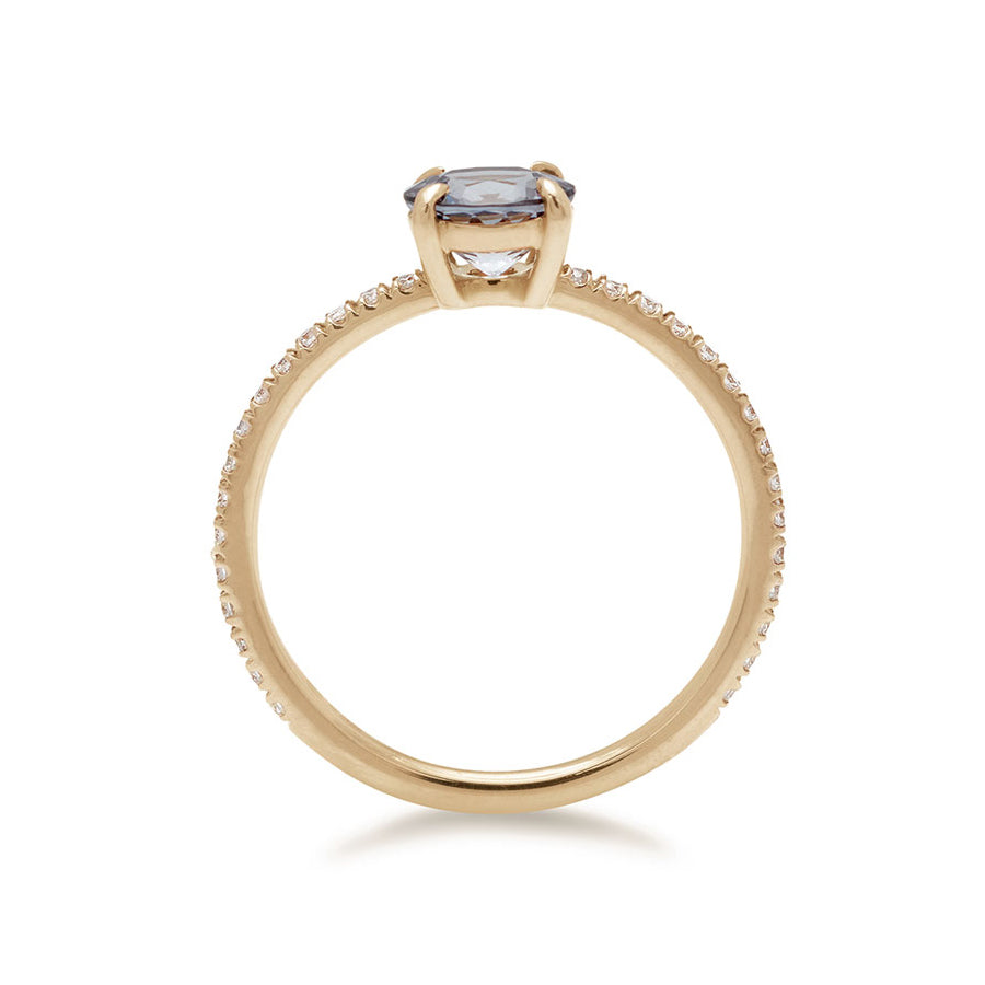 Side view of a solitaire round grey spinel ring with claw prongs with white diamond pave on the band set in yellow gold., Yellow Gold