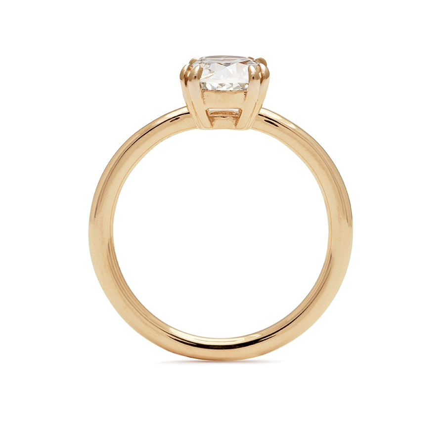 Side view of a solitaire round brilliant cut 1.50ct white diamond ring with double claw prongs set in yellow gold., Yellow Gold