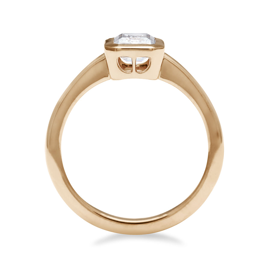 Side view of a elongated emerald cut bezel set lab white diamond set in yellow gold., Yellow Gold