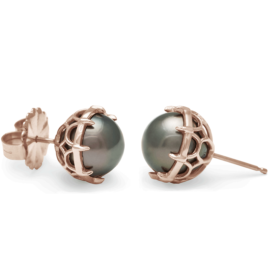 A pair of peacock pearl studs set in rose gold both angled