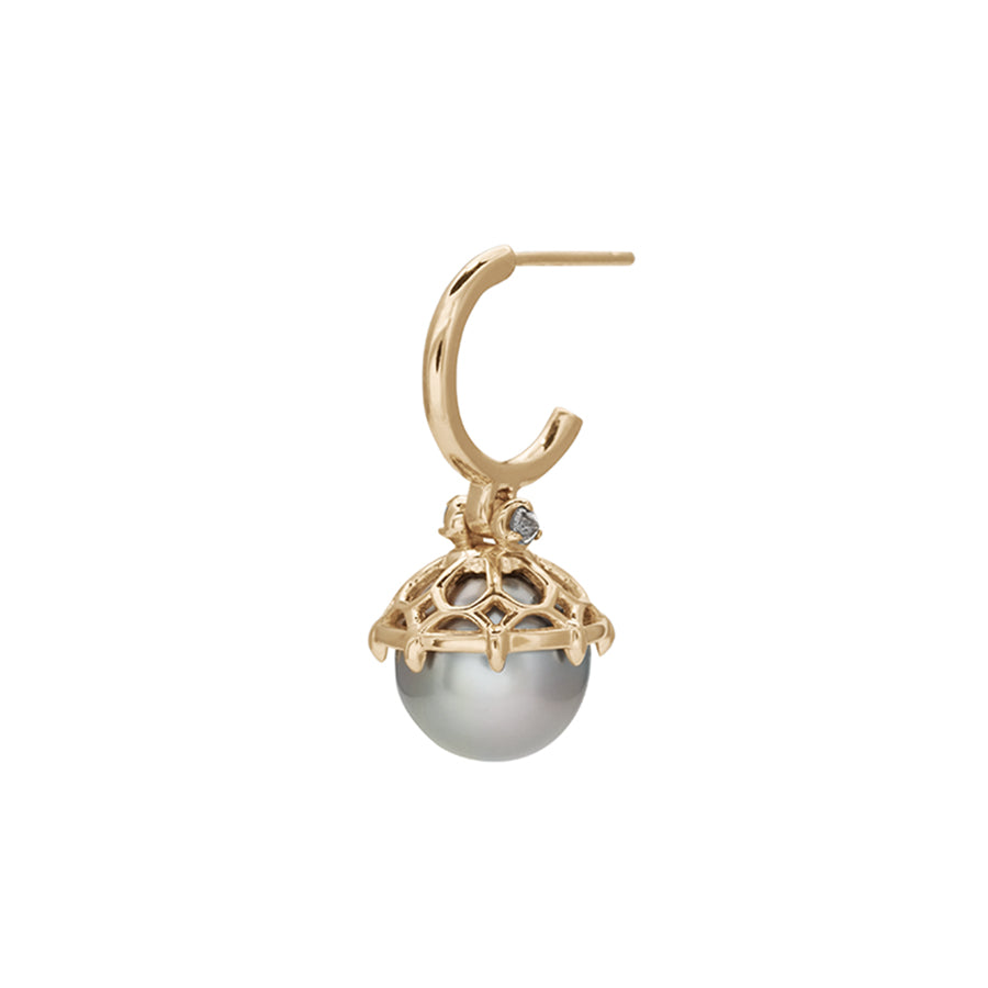 Angled view of a single hoop with a light pearl hanging from it with grey diamond accents on either side set in yellow gold.