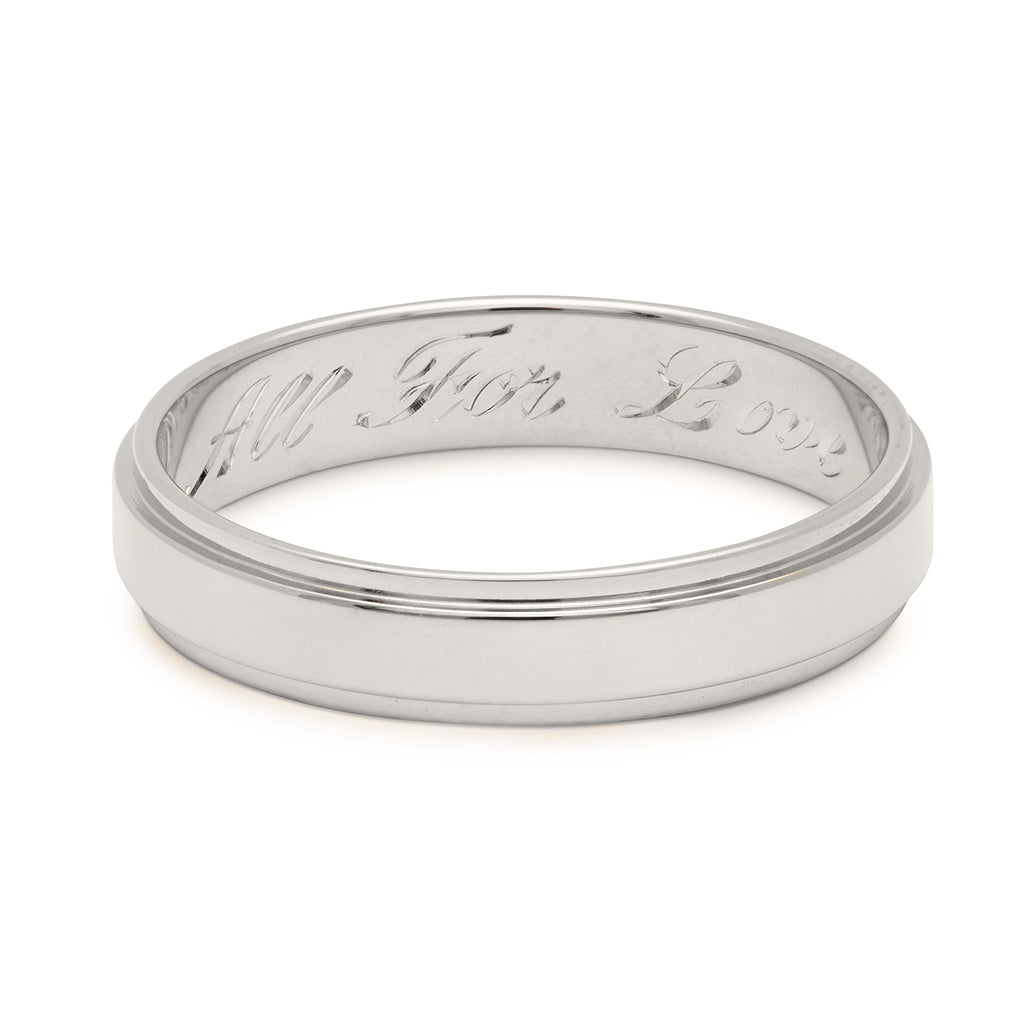 A white gold flat edge solid gold band with "All For Love" engraved on the inside., White Gold
