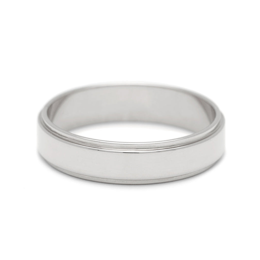 A 4mm flat edge band set in white gold., White Gold