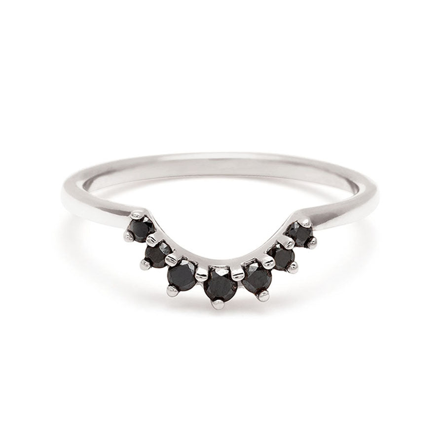 A curve band with 7 black diamonds set in white gold., White Gold
