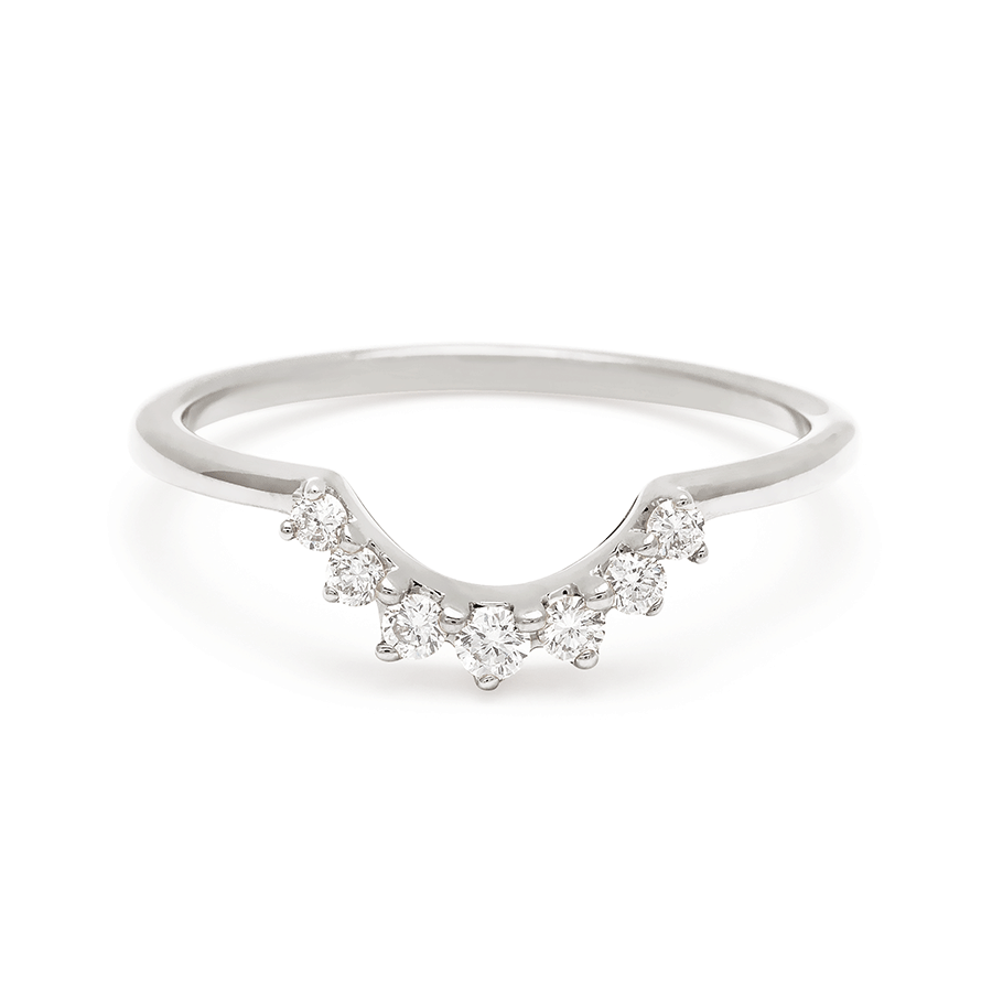 A curve band with 7 white diamonds set in white gold., White Gold