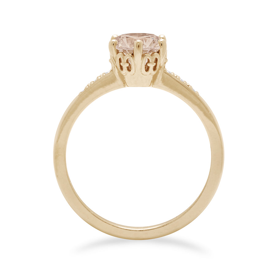 Side view of a solitaire ring with a round brilliant cut 0.75ct champagne diamond with white diamond pave on either side set in yellow gold., Yellow Gold