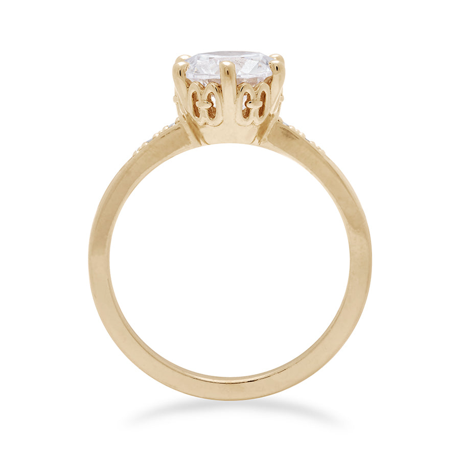 Side view of a solitaire ring with a round brilliant cut 1.50ct white diamond with white diamond pave on either side set in yellow gold., Yellow Gold