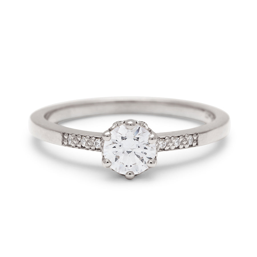 A solitaire ring with a round brilliant cut 0.50ct white diamond with white diamond pave on either side set in white gold., White Gold
