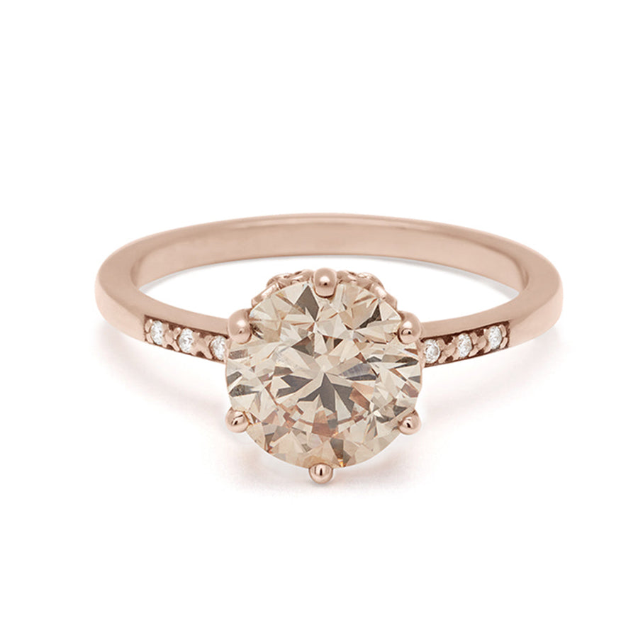 A solitaire ring with a round 2.00ct champagne diamond with white diamond pave on either side set in rose gold., Rose Gold