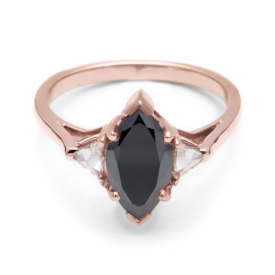 A three stone engagement ring with a marquise shape 1.25ct black diamond center stone with two white diamond trillion side stones set in rose gold., Rose Gold