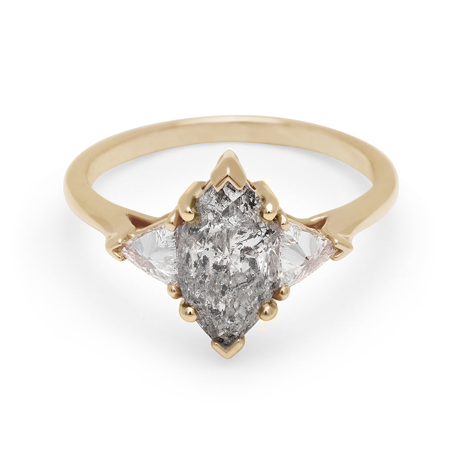 A three stone engagement ring with a marquise shape 1.50ct grey diamond center stone with two white diamond trillion side stones set in yellow gold., Yellow Gold
