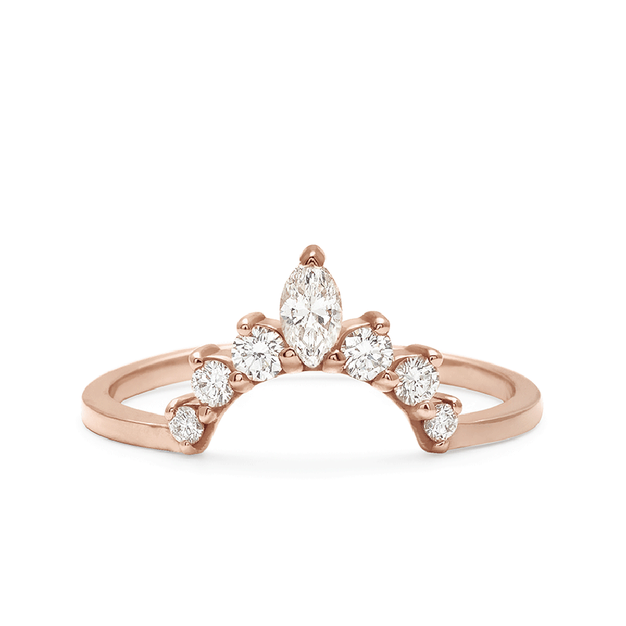 A curved band with three round white diamonds on either side of a marquise white diamond set in rose gold., Rose Gold
