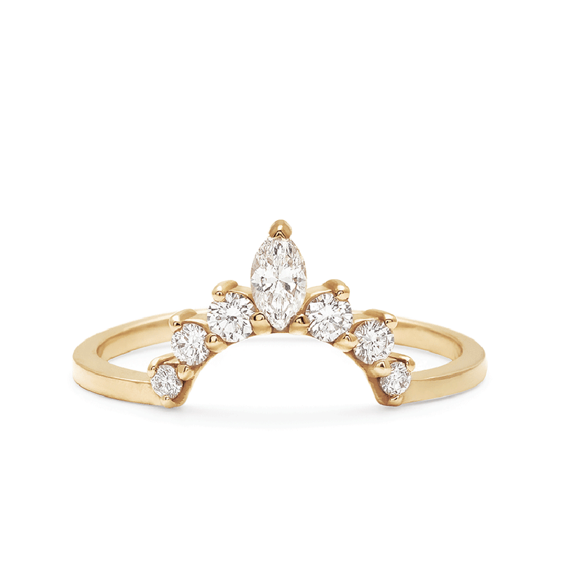 A curved band with three round white diamonds on either side of a marquise white diamond set in yellow gold., Yellow Gold