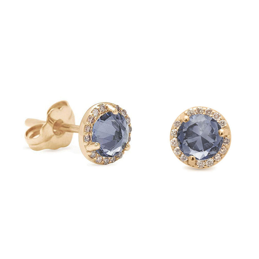 A pair of medium grey spinel center stone earrings with a halo of champagne diamond set in yellow gold with one earring angled.