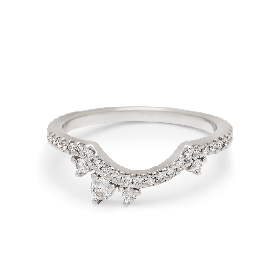 An asymetrical white diamond scalloped band with dusted white diamond around the band set in white gold., White Gold