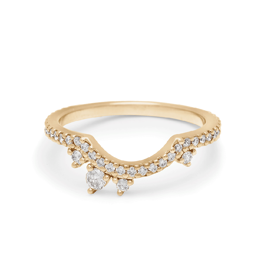 An asymetrical white diamond scalloped band with dusted white diamond around the band set in yellow gold., Yellow Gold