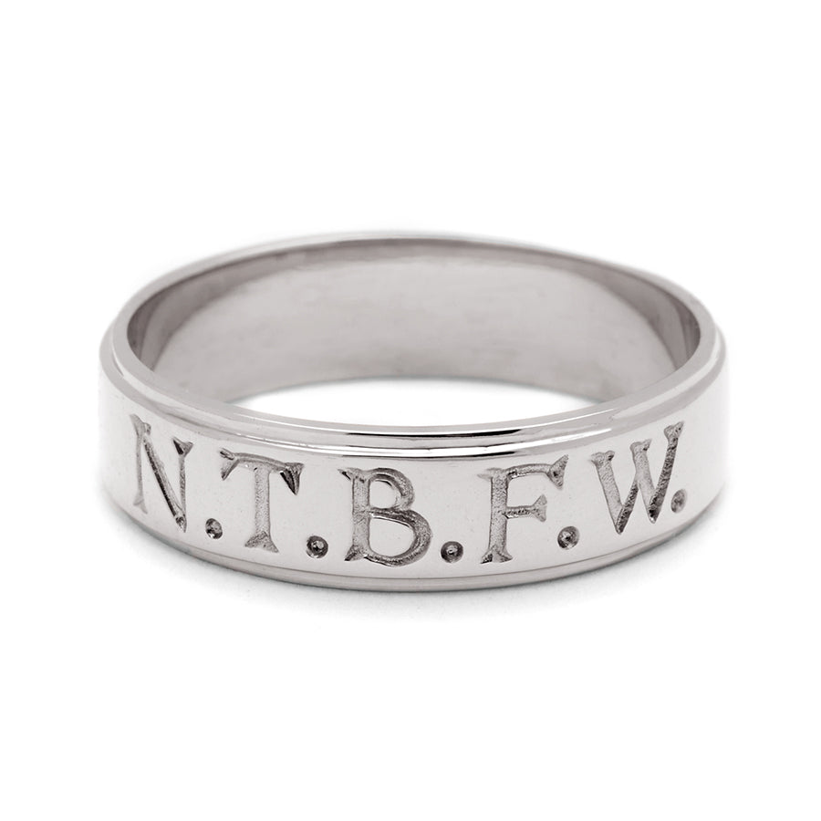 A white gold 6mm flat edge band with "N.T.B.F.W." engraved on the outside., White Gold