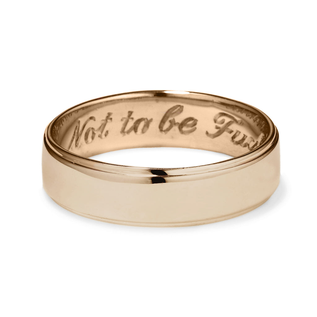 A yellow gold flat edge band in 5mm with "Not to Be F**ked With" engraved on the inside., Yellow Gold