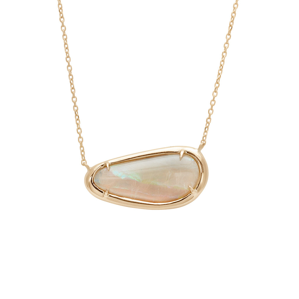 A necklace with an opal set in bezel with claw prongs set in yellow gold on a yellow gold chain.