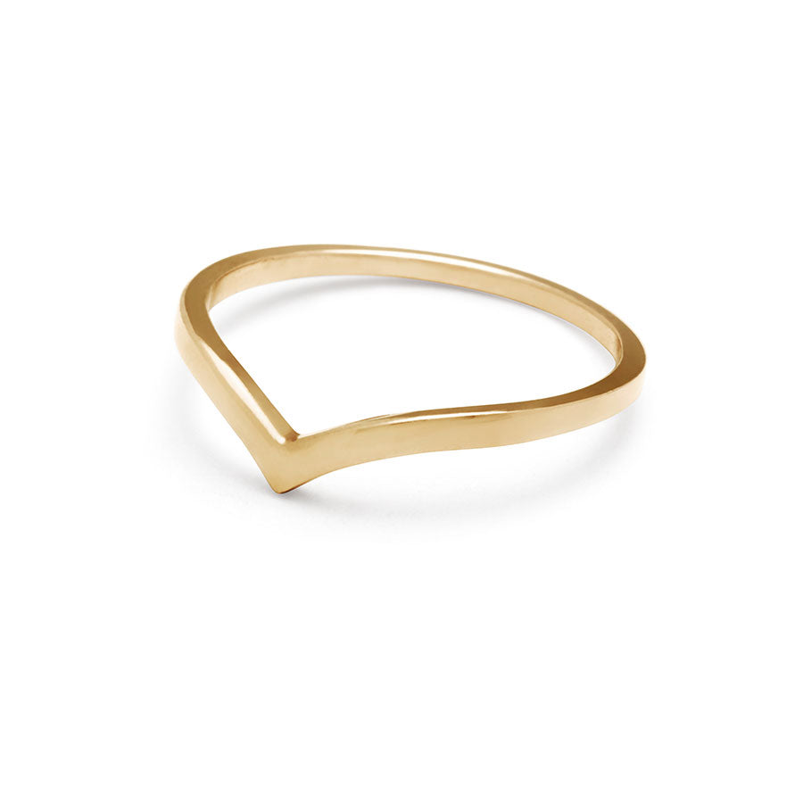 Angled view of a solid gold band in a pointed shape set in yellow gold.
