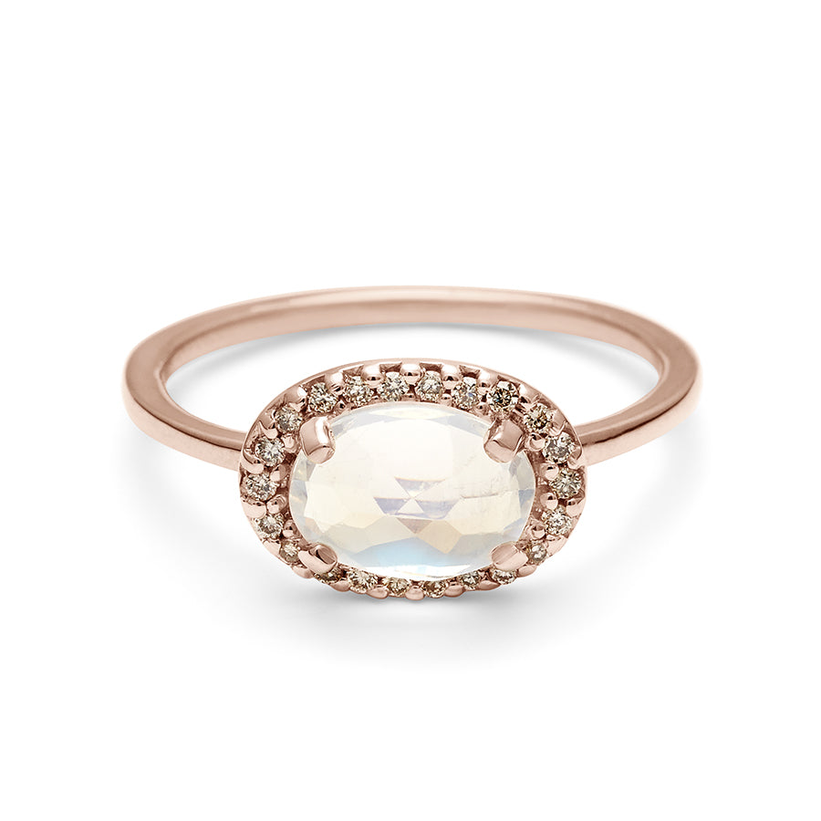 A ring with an oval shape rainbow moonstone center stone surrounded by a champagne diamond pave halo set in rose gold., Rose Gold