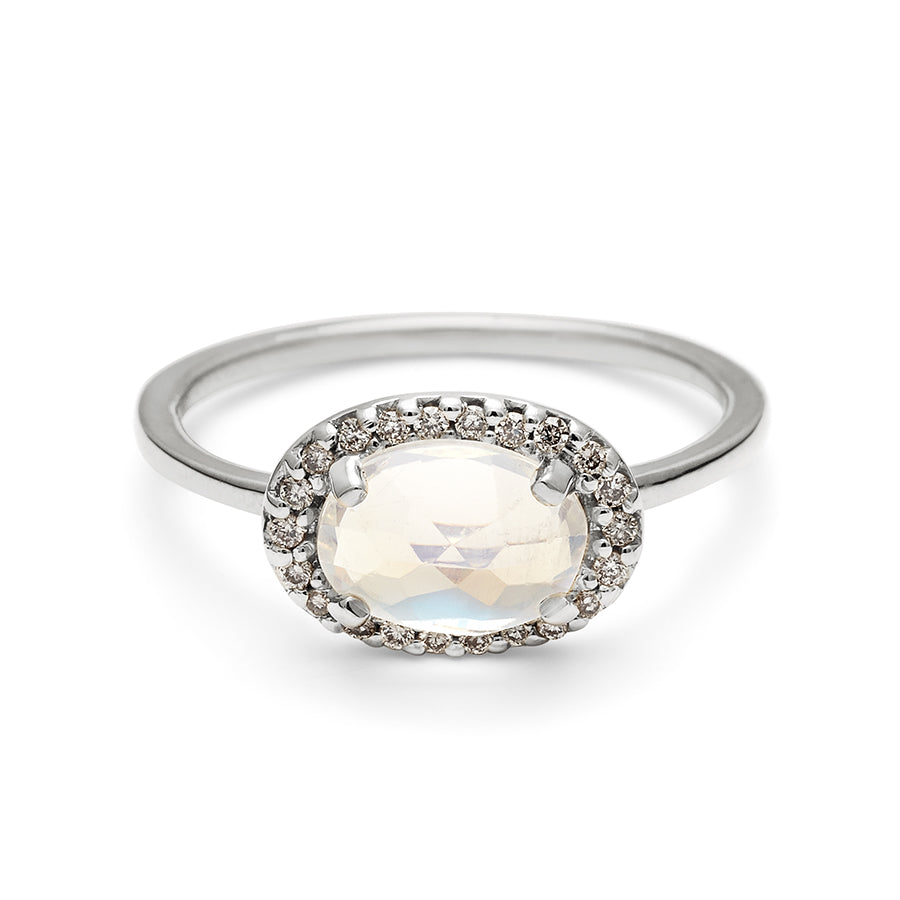A ring with an oval shape rainbow moonstone center stone surrounded by a champagne diamond pave halo set in white gold., White Gold