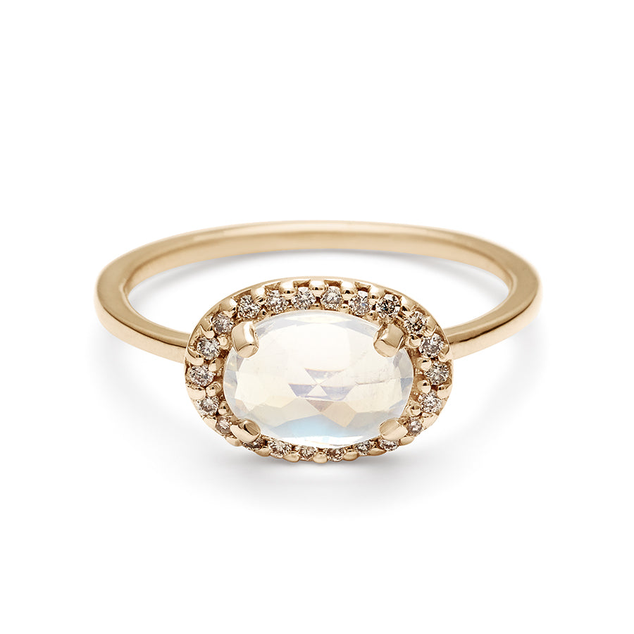 A ring with an oval shape rainbow moonstone center stone surrounded by a champagne diamond pave halo set in yellow gold., Yellow Gold