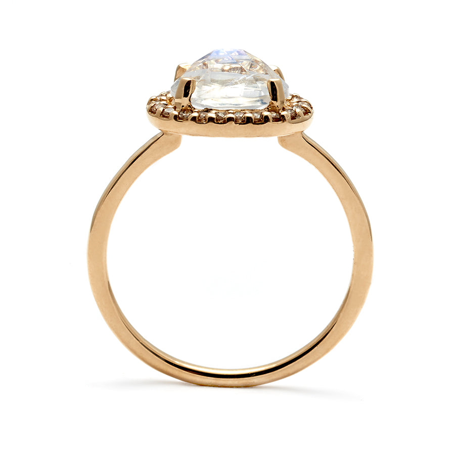 Side view of a ring with an oval shape rainbow moonstone center stone surrounded by a champagne diamond pave halo set in yellow gold., Yellow Gold