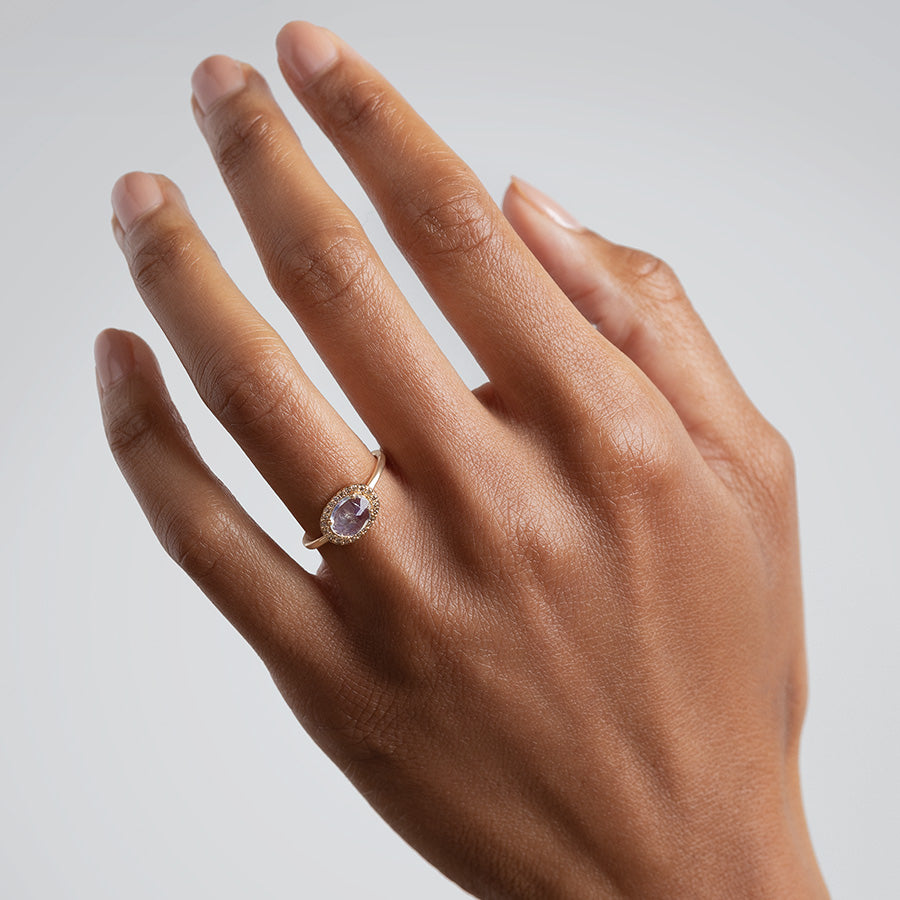 A ring with an oval shape rainbow moonstone center stone surrounded by a champagne diamond pave halo set in rose gold on a medium-complexion ring finger., White Gold, Rose Gold, Yellow Gold