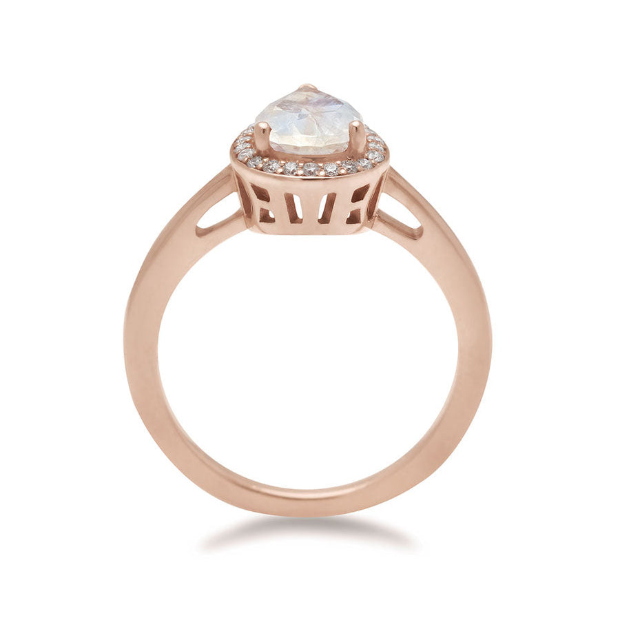 Side view of an engagement ring with a pear shape rainbow moonstone center stone surrounded by a white diamond pave halo set in rose gold., Rose Gold