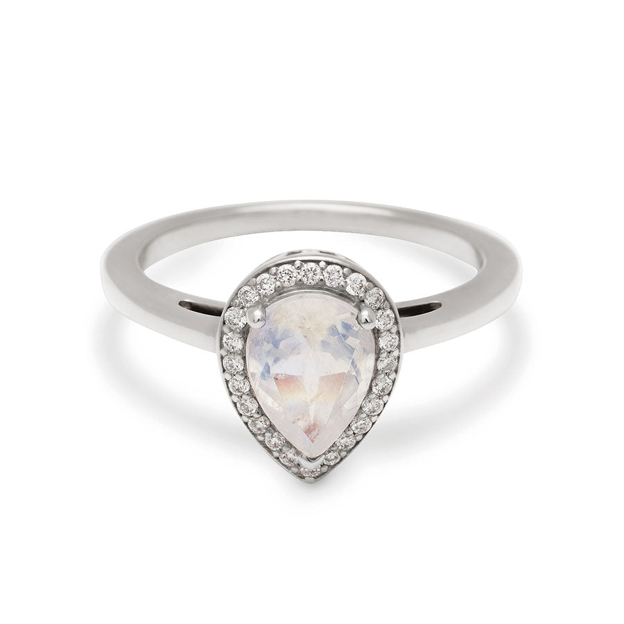 An engagement ring with a pear shape rainbow moonstone center stone surrounded by a white diamond pave halo set in white gold., White Gold