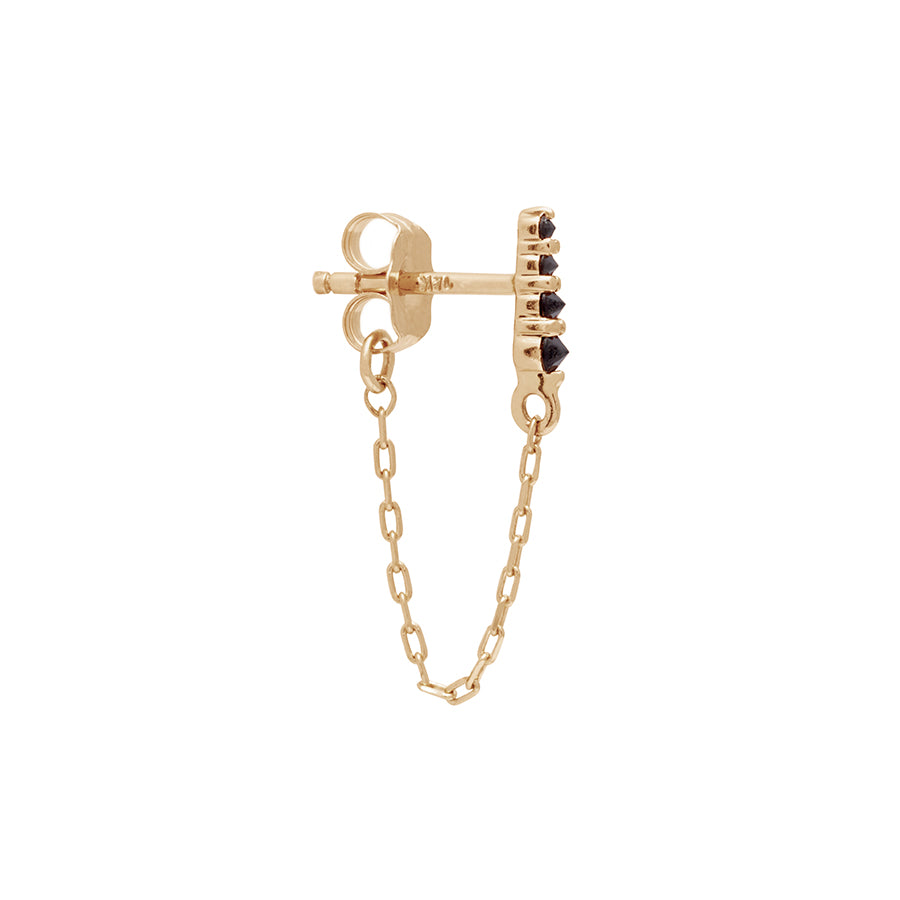 A single earring with four black diamonds with a chain connecting to the ear back set in yellow gold., Yellow Gold