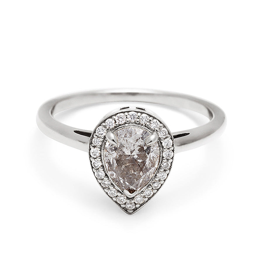 An engagement ring with a pear shape grey diamond center stone surrounded by a white diamond pave halo set in white gold., White Gold