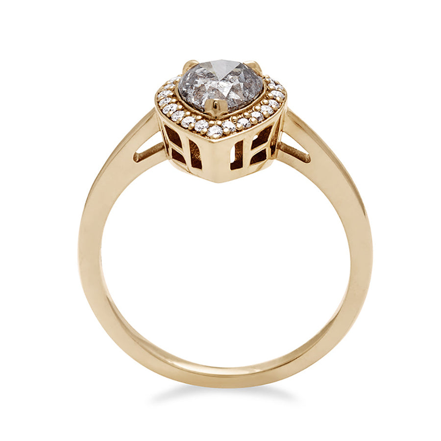 Side view of an engagement ring with a pear shape grey diamond center stone surrounded by a white diamond pave halo set in yellow gold.