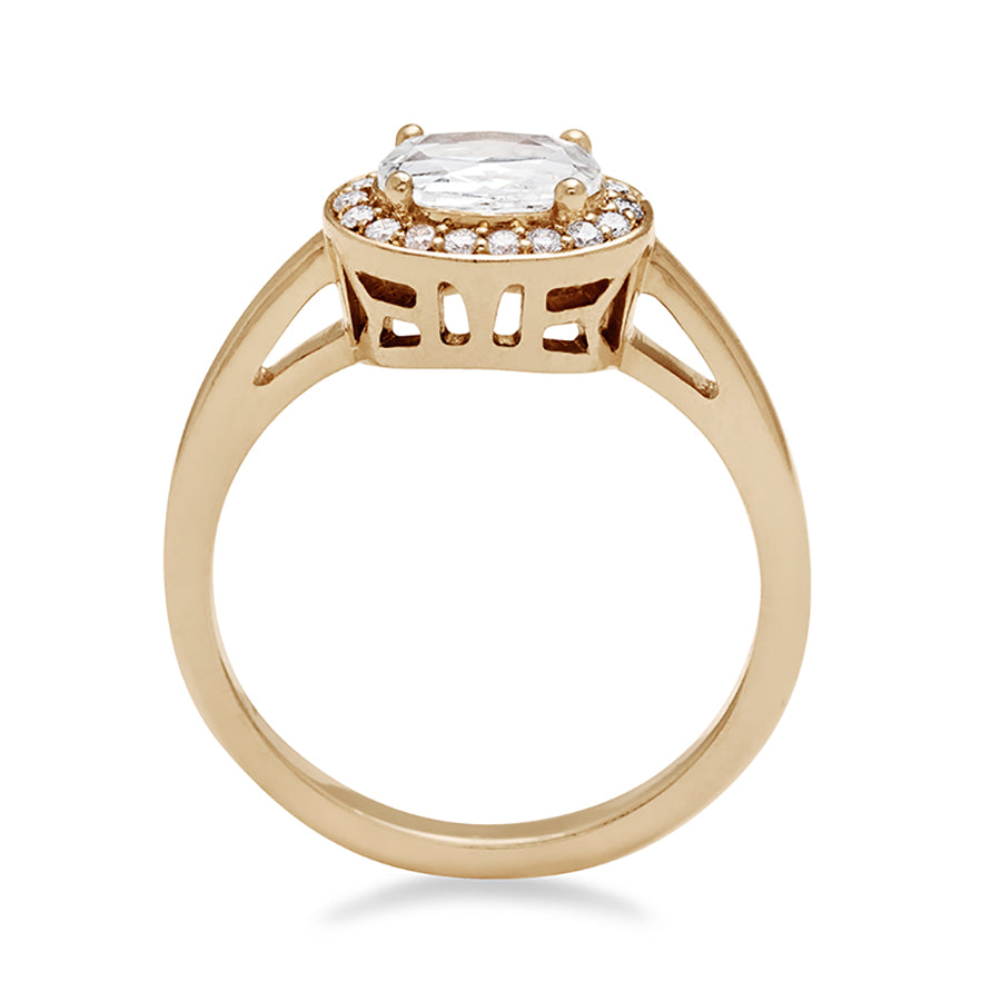 Side view of an engagement ring with a rose cut and oval shape white diamond center stone surrounded by a white diamond pave halo set in yellow gold.